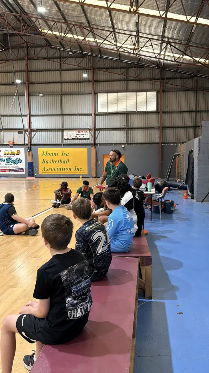 A team talk on the benches at the Holiday Program