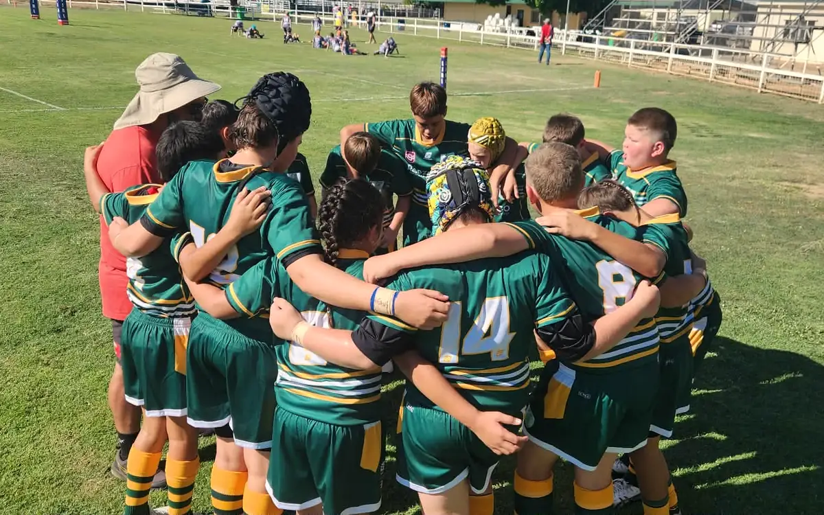 The Outback Stylers in a huddle on game day at the Matt Scott Tournament