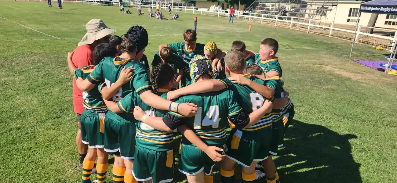 The Outback Stylers in a huddle on game day