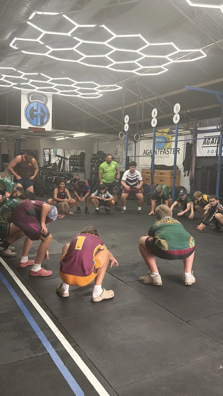 Players squatting in a circle during a CrossFit session